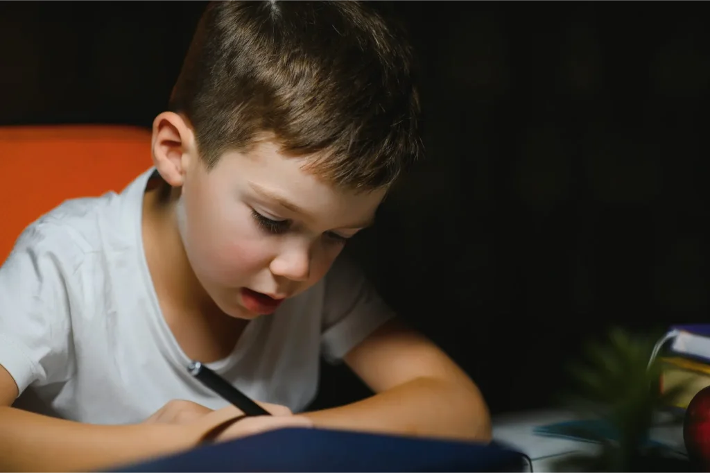 schoolboy doing homework at the table in his room 2025 03 17 23 43 49 utc 2048x1363.jpg 1